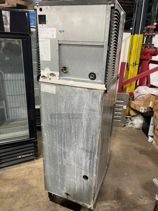 Manitowoc SD0423W/QPA160 stainless steel ice maker and dispenser, electric, water-cooled, on legs, 115/120V, used condition.