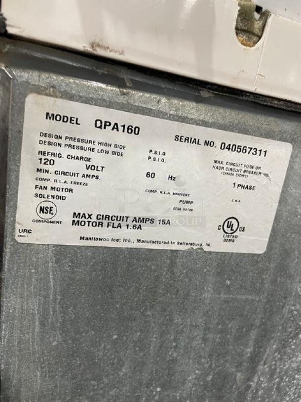 Manitowoc stainless steel ice machine, model SD0423W/QPA160, 115/120V, water-cooled, on legs, with storage bin.