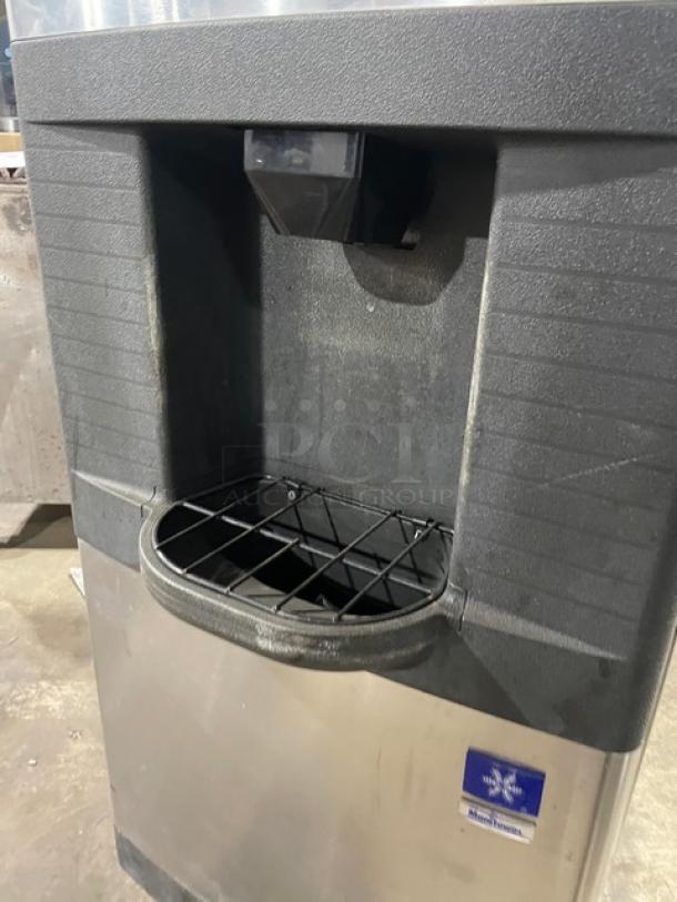 Manitowoc stainless steel ice machine, model SD0423W/QPA160. Water-cooled, electric-powered. On legs, used condition.