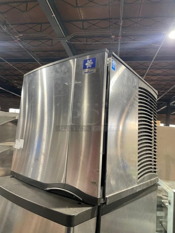 Manitowoc SD0423W/QPA160 stainless steel ice maker, water-cooled, on legs, commercial use, model and brand labels visible.