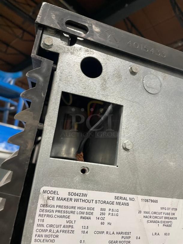 Manitowoc stainless steel ice machine, model SD0423W/QPA160, serial 110679665, electric water-cooled, on legs.