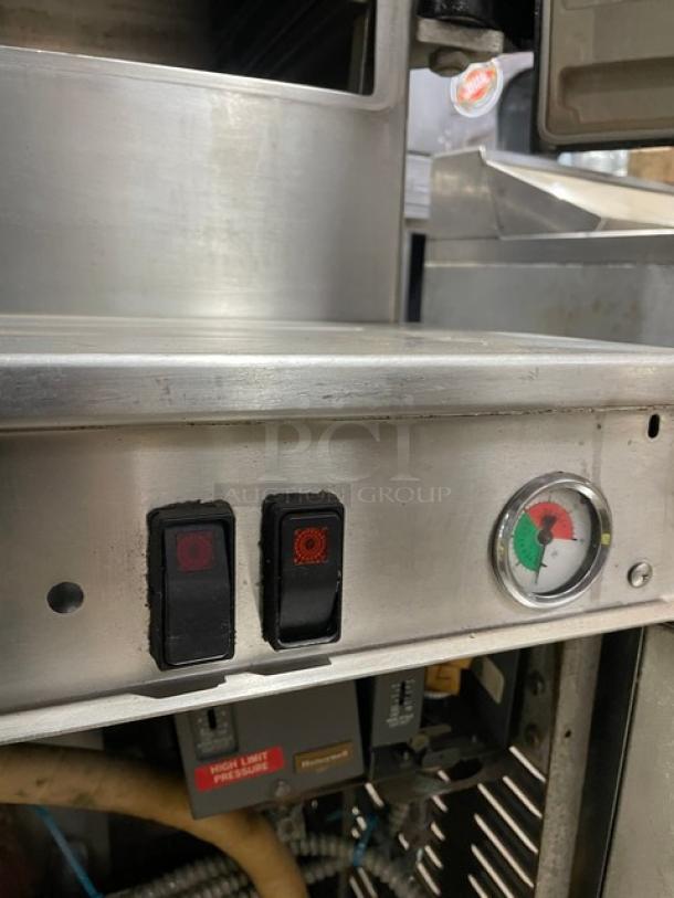 Cleveland Range 2-compartment stainless steel pressure steamer, natural gas, with individual controls and built-in pan slides.