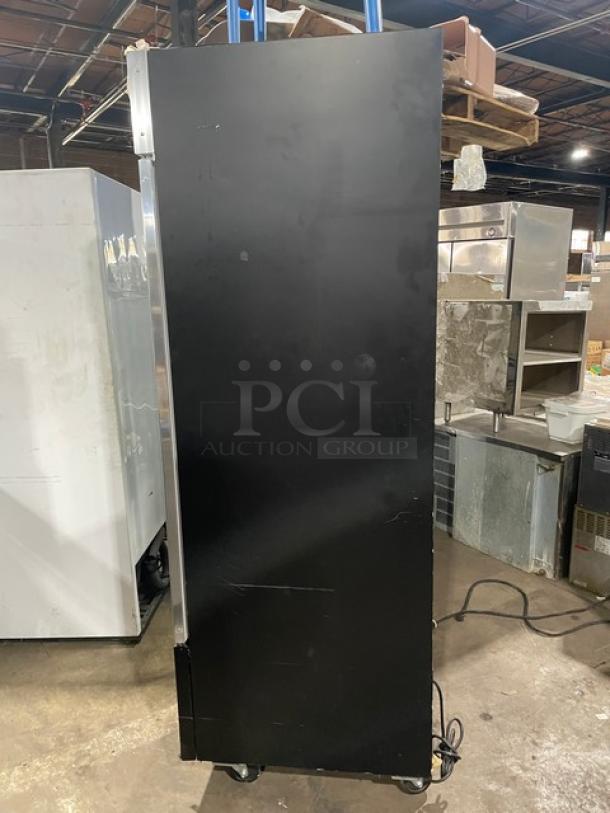 Spartan Model SGM-72RS reach-in refrigerator, black powder-coated, on casters, showing side view.