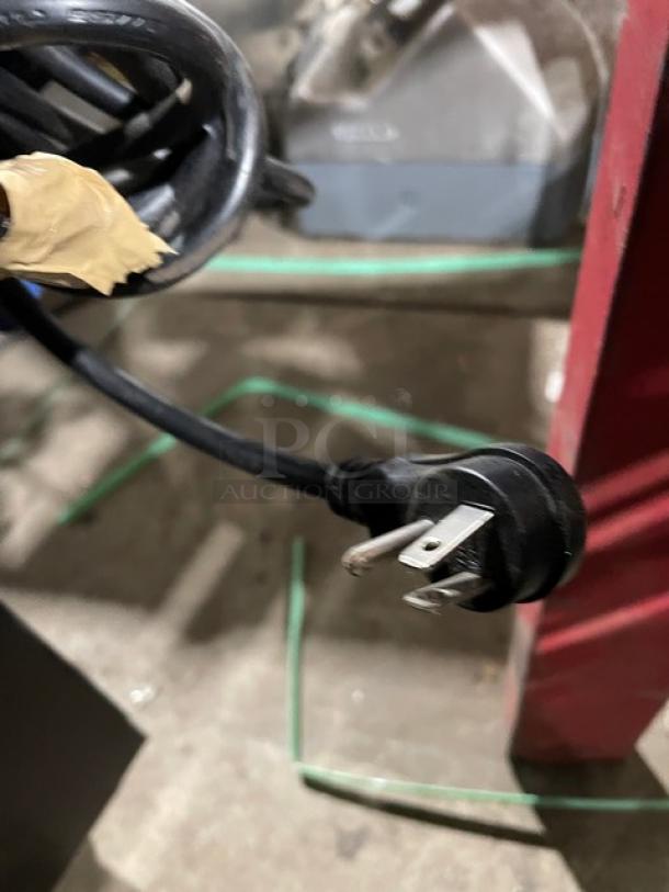 Close-up of a power cord plug for a Spartan SGM72RS commercial refrigerator.