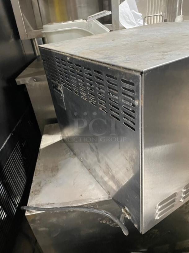 Bakers Pride P18 commercial stainless steel electric countertop pizza oven, single chamber, double deck, side view.