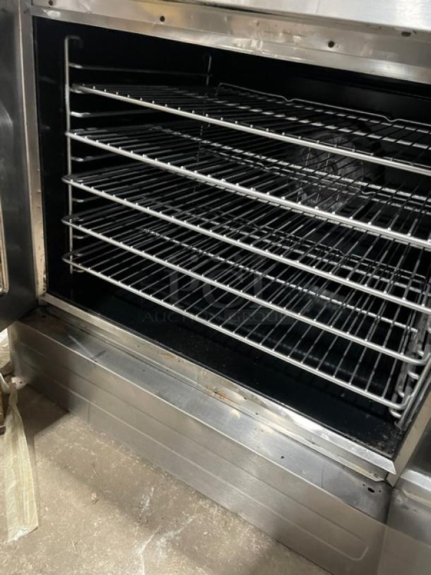 Blodgett commercial stainless steel convection oven, electric powered, with thermostatic control and wired oven racks.