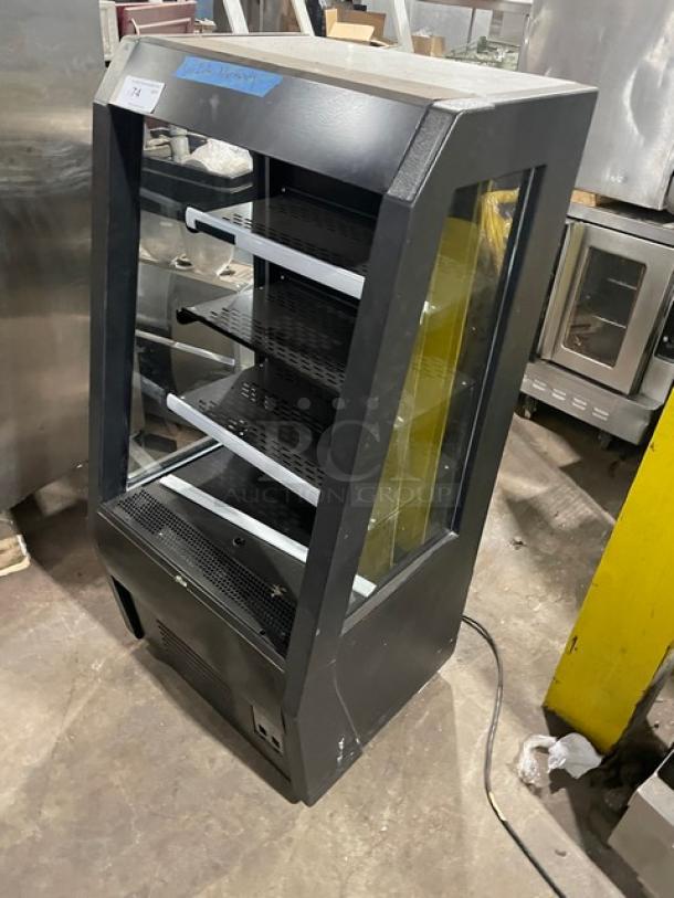 Avantco black refrigerated display case, model 189BMAC26HC, with multi-tier shelves, pull-down night curtain, on casters.