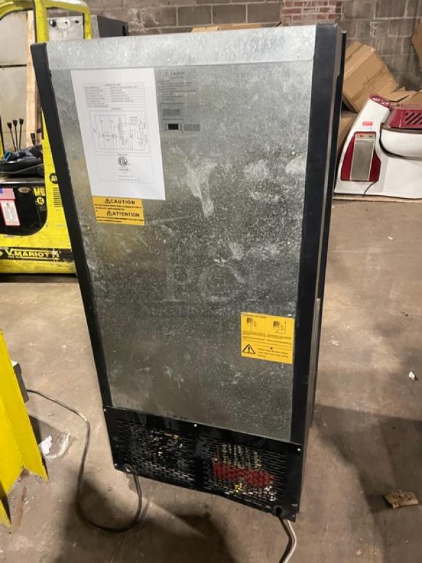 Avantco black multi-tier refrigerated display case, model 189BMAC26HC, with pull-down night curtain and casters, shown from the back with caution labels.