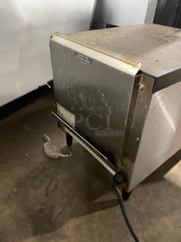 Hatco Toast-Qwik TQ20BA stainless steel commercial conveyor toaster, 208V, on legs, used condition, visible markings.
