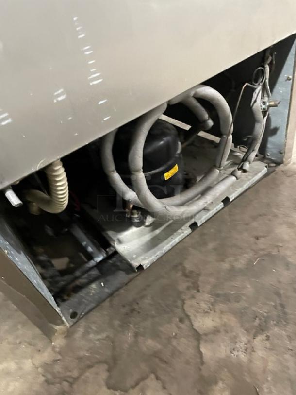 Turbo Air Deluxe Cooler Series TSR-23D commercial refrigerator compressor view, showing electrical components and tubing.