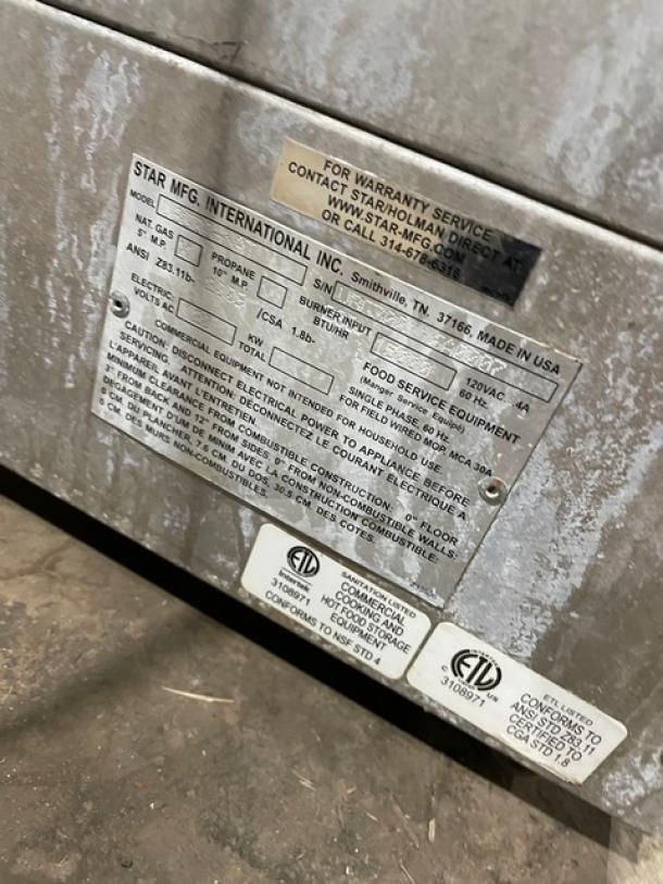 Stainless steel Star Max VBG30 vertical gyro broiler, natural gas, 120V 1 phase, model tag visible, on legs.