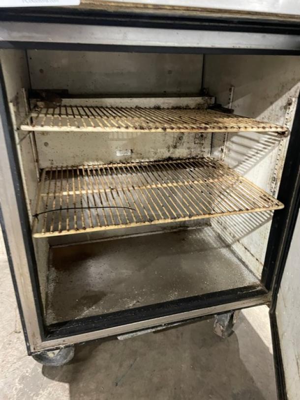 True TWT-27 commercial stainless steel refrigerator, 27", single door, poly-coated wire rack, on casters, used condition.