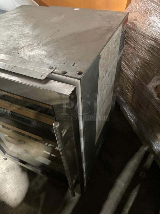 Sub-Zero Model 424 wine cooler, stainless steel, single glass door, dual zone, single section, 115V, visible wear.