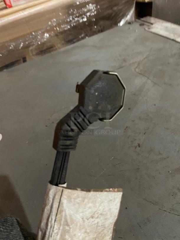 Alt text: Sub-Zero wine cooler model 424; image shows the power cord plug.