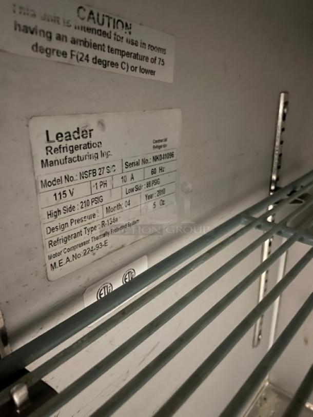 Leader NSFB27SC stainless steel undercounter refrigerator with poly coated wire rack, model and serial number label visible.