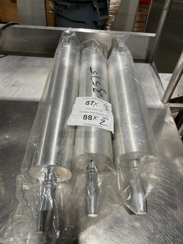 New commercial heavy-duty rolling pins, set of three, wrapped in plastic. Includes auction label with bid information.