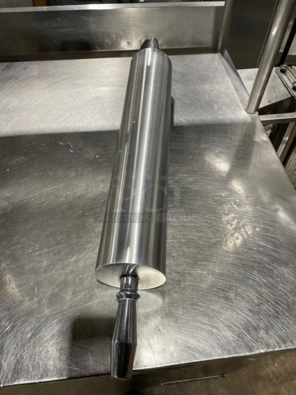 Heavy-duty stainless steel rolling pin, commercial grade, new condition, with ergonomic handles for easy use.