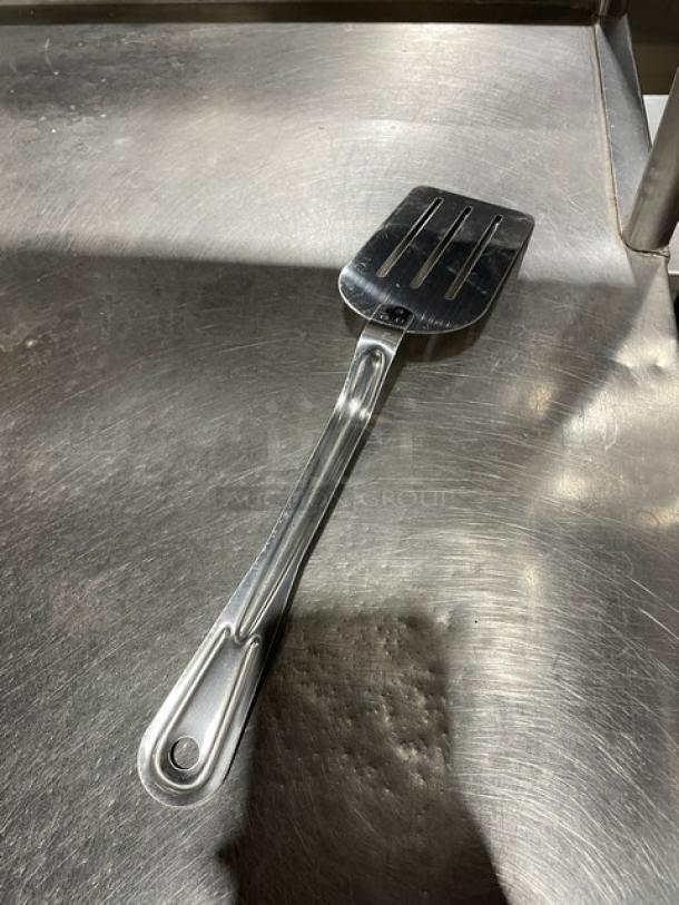 NEW Adcraft SL-80 stainless steel slotted kitchen turner, 6-inch. Pristine condition, durable design, ideal for commercial use.