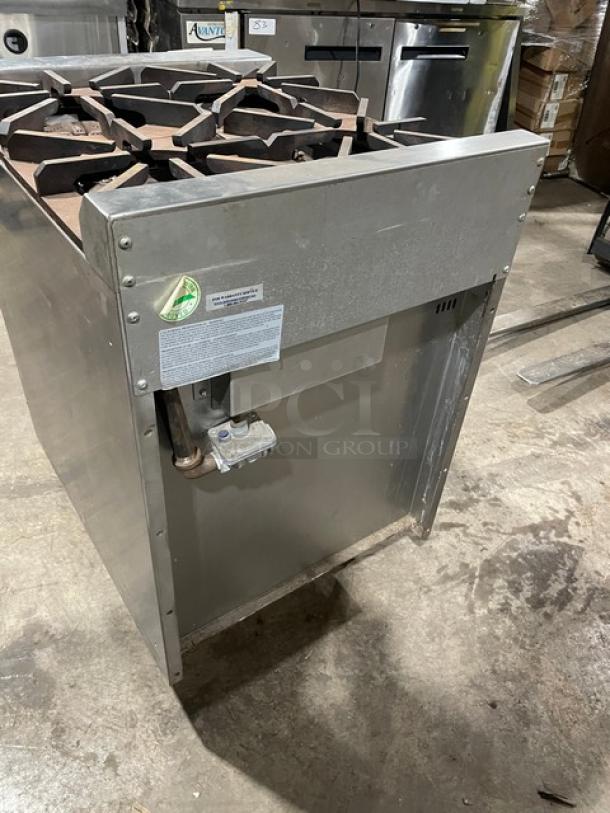 Jade Range JBR424 stainless steel gas 4-burner range/oven combo, with wired oven rack, SN: 0000048816VL, on legs.