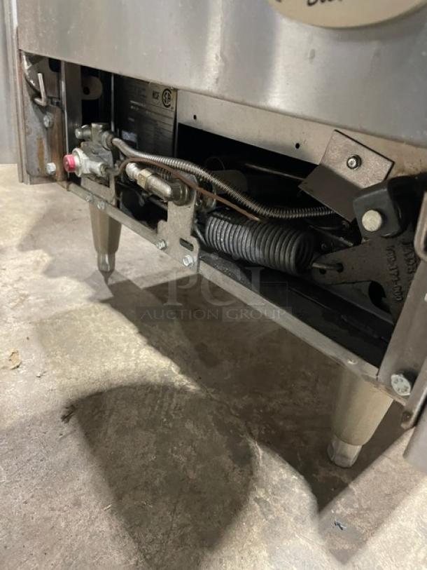 Jade Range JBR-4-24 commercial stainless steel gas range, visible wiring, on legs, model and serial number label.