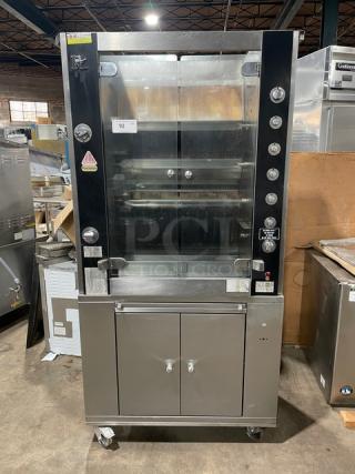 Rotisol Model 9505 stainless steel rotisserie oven, natural gas, tempered glass doors, 2-door cabinet base, retractable workstation.