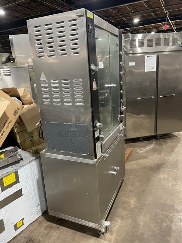 Rotisol 9505 commercial stainless steel rotisserie oven with tempered glass doors, enclosed cabinet base, and retractable workstation.