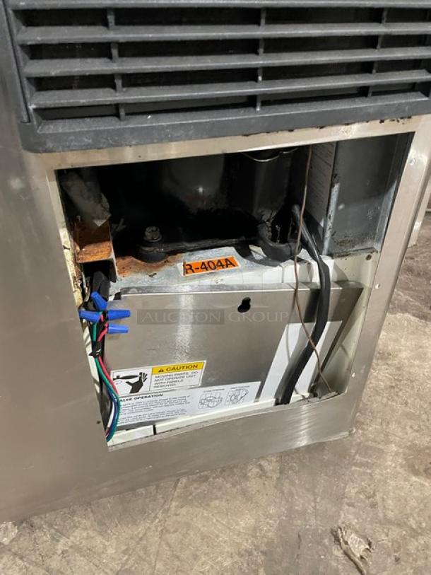 Hoshizaki KM-515MAH ice machine head, stainless steel, electric, air-cooled, visible R-404A label, interior wiring exposed.
