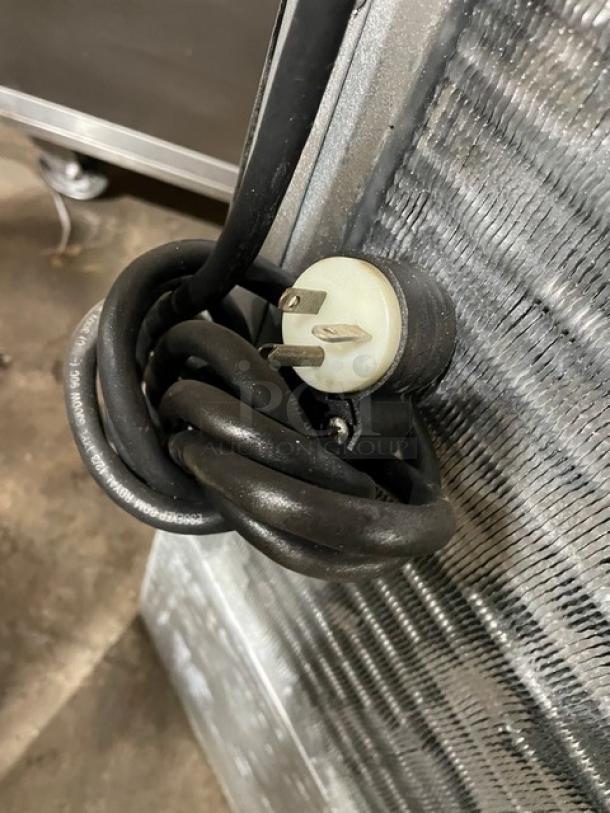 Hoshizaki KM-515MAH ice machine head, stainless steel, electric, air-cooled, showing power cord and plug.