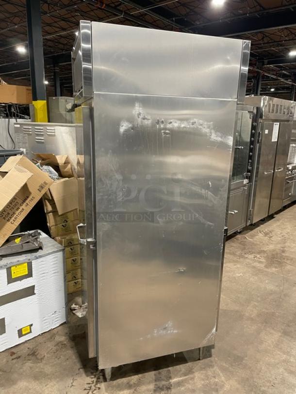Continental DL1REPT Stainless Steel Single Door Pass-Thru Refrigerator, built-in pan slide, 115V, on legs, used condition.