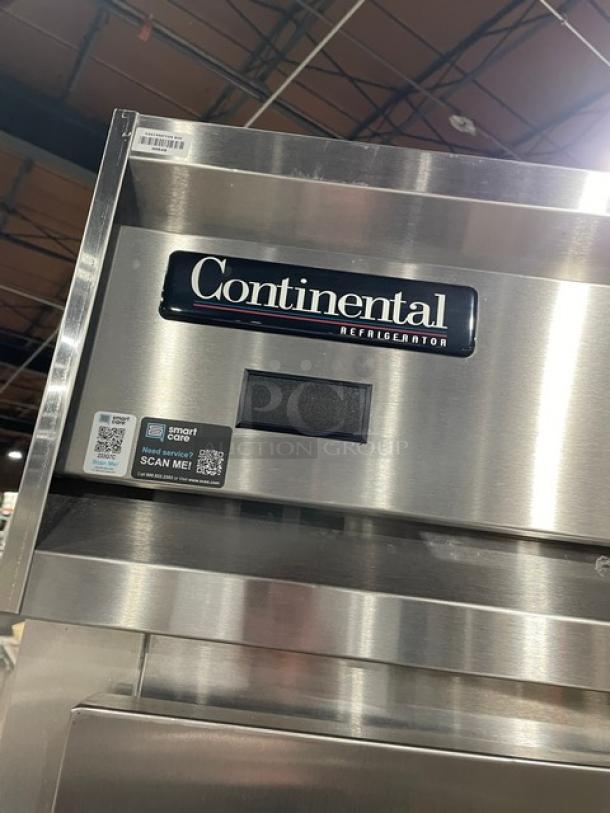 Continental Commercial Stainless Steel Pass-Thru Refrigerator, Model DL1REPT, with built-in pan slide, in excellent condition.