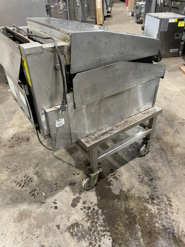 Lang commercial stainless steel countertop infrared clamshell griddle, model 224TH-NATMG, on equipment stand with casters.