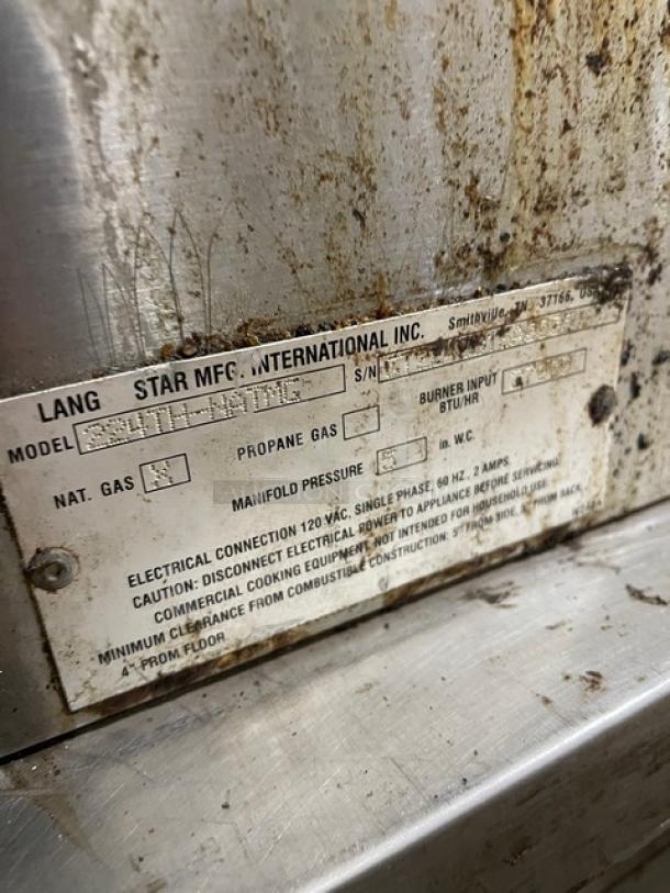 Lang 224TH-NATMG stainless steel gas-powered clamshell griddle with equipment stand. Label shows model and specs. Used condition.