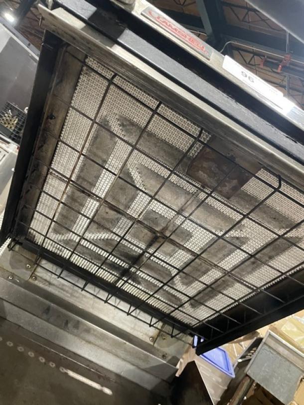 Lang stainless steel gas clamshell griddle, model 224TH-NATMG, with infrared technology and equipment cart on casters.