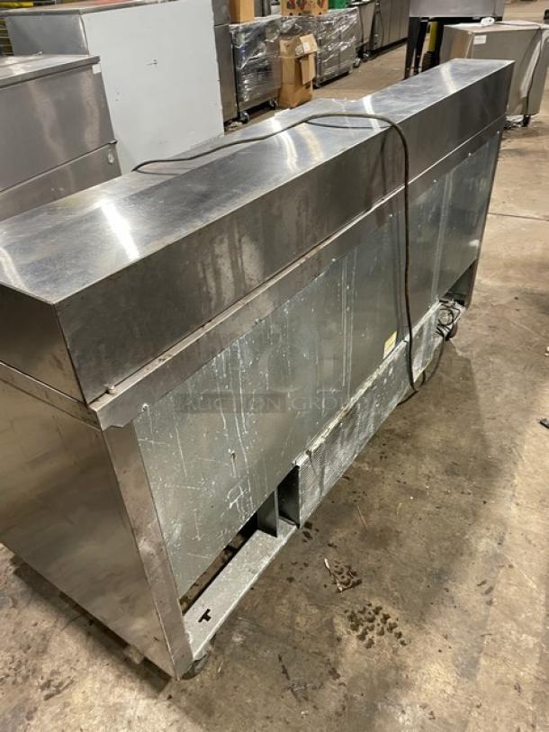 Beverage-Air Elite 3-door stainless refrigerated prep table, model SPE72-18, includes poly-coated rack, on casters.