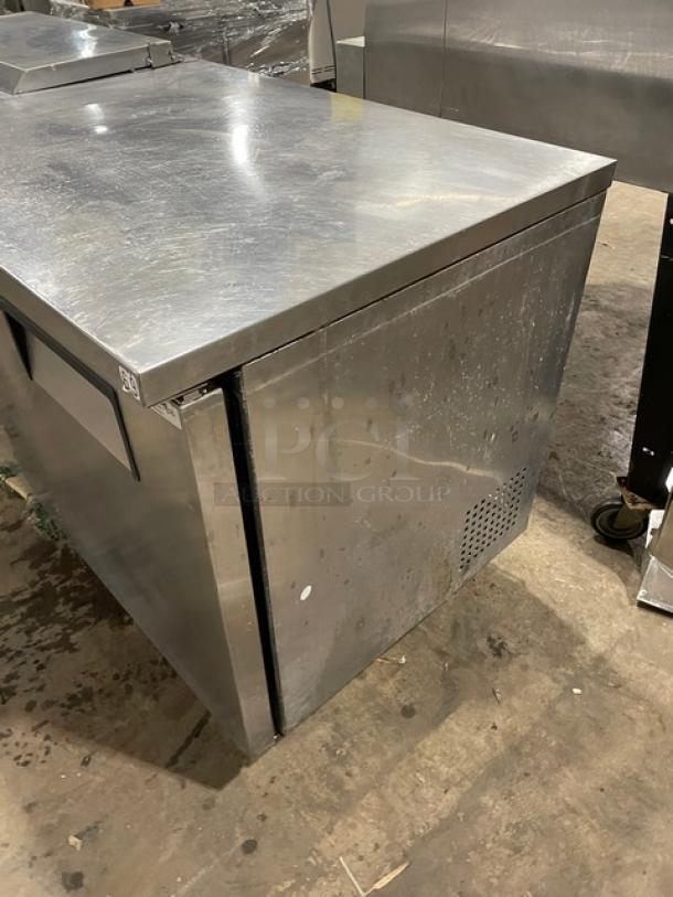 True TSSU-72-08 sandwich prep table, stainless steel, 3 doors, includes poly-coated wire rack, model visible, commercial use.