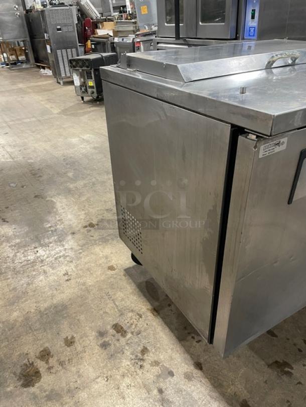 True TSSU-72-08 stainless steel 3-door prep table with poly-coated rack, 72-inch, model SN 7209771, lightly used condition.