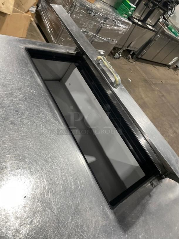 True TSSU-72-08 stainless steel 3-door prep table with poly-coated rack. Good condition, 72" wide, 115V 1 phase.