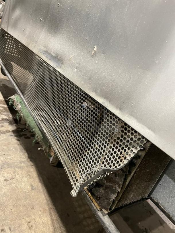 True Commercial 3 Door Refrigerated Prep Table, Model TSSU-72-08, visible wear, features poly-coated wire rack.