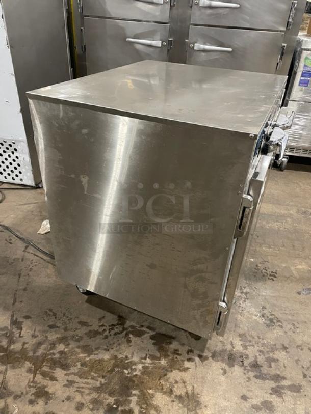 Alto-Shaam 750-CTUS stainless steel 2-door hot food holding cabinet on casters, commercial use, model 750-CTUS, pre-owned.