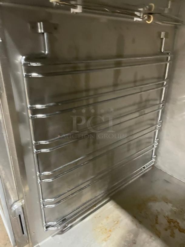 Alto-Shaam 750CTUS stainless steel hot food holding cabinet interior, rack shown, commercial use, electric powered, on casters.