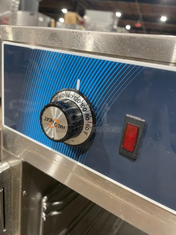 Alto-Shaam 750CTUS hot food holding cabinet, stainless steel, electric, temperature dial and indicator light, on casters.