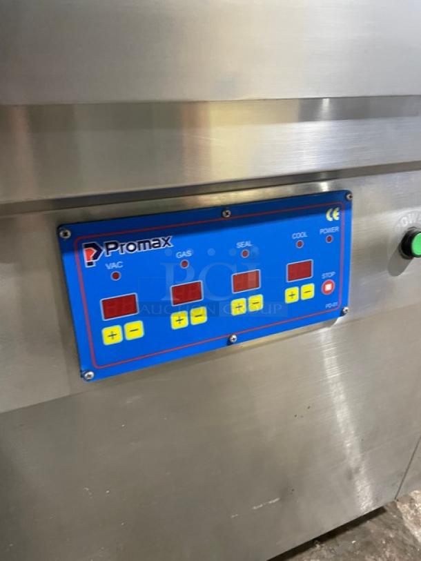 Promax stainless steel vacuum tray sealer with digital controls, on casters, working condition, commercial-grade.