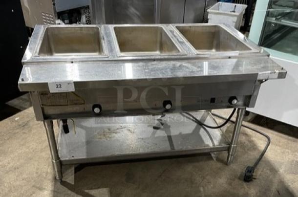 Eagle Group stainless steel 3-well hot food table with tray slide, single undershelf, on legs, electric powered, commercial-grade.