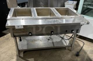Eagle Group stainless steel 3-well hot food table with tray slide, single undershelf, on legs, electric powered, commercial-grade.