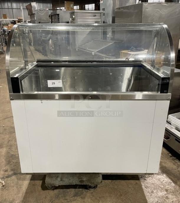 Commercial white curved glass horizontal ice cream/frozen yogurt dipping cabinet with rear lift-open access. SN: N1902303.