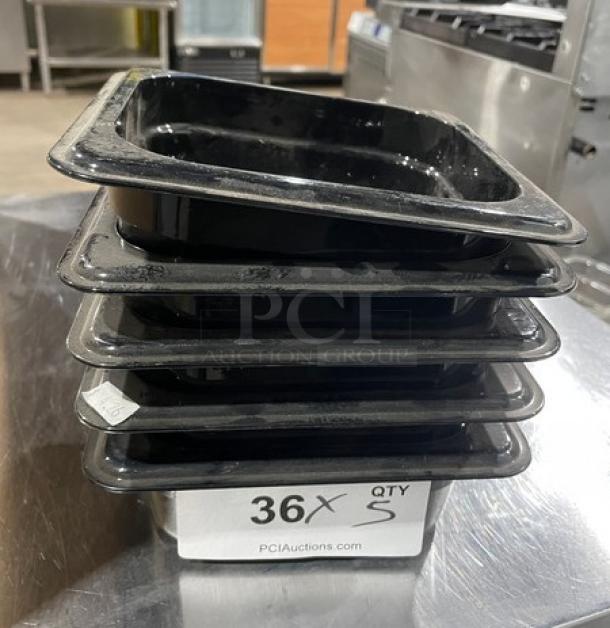 NEW Cambro black 1/6-size 2.5" deep food pans, set of five. Stack of pans in a commercial kitchen setting; labeled as quantity 36 on auction site.