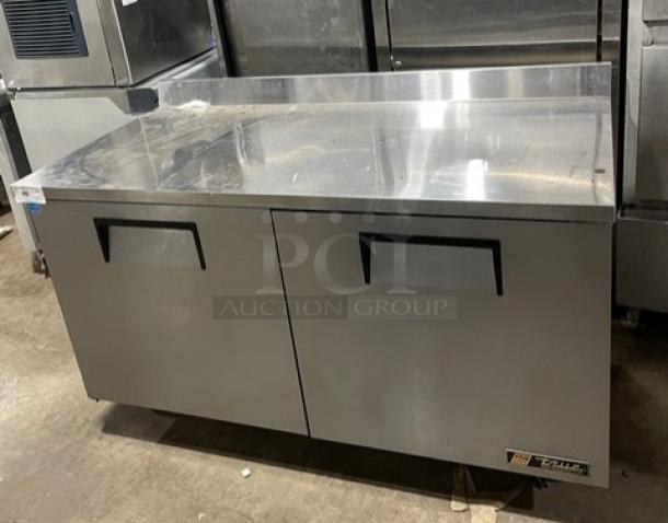 True TWT-60 stainless steel 2-door worktop refrigerator with backsplash, poly coated rack, on casters, Energy Star certified.