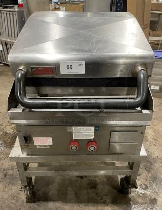 Lang 224TH-NATMG stainless steel natural gas clamshell griddle on caster cart. Infrared, good condition, visible controls, labels.