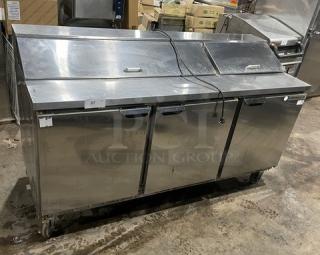 Beverage-Air Elite Series 3-Door Refrigerated Prep Table, model SPE72-18, stainless steel, with poly-coated wired rack, on casters.