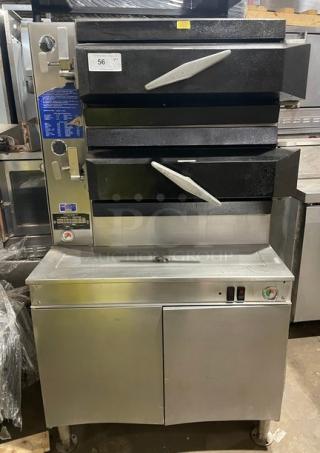 Cleveland Range stainless steel 2-compartment pressure steamer, natural gas, individual controls, enclosed cabinet base.